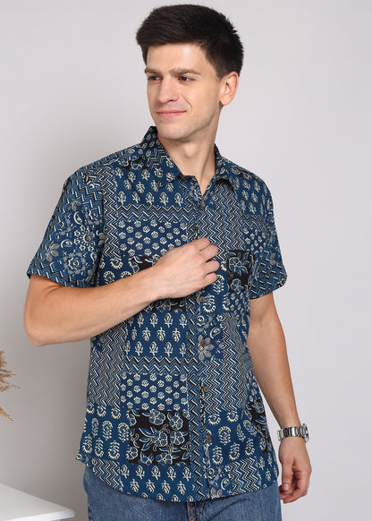 Man wearing a blue patterned shirt 